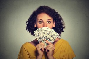 person-holding-fanned-out-money