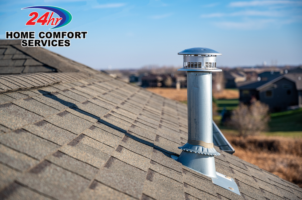 Galvanized metal vent exhaust on asphalt roof with a rain cap